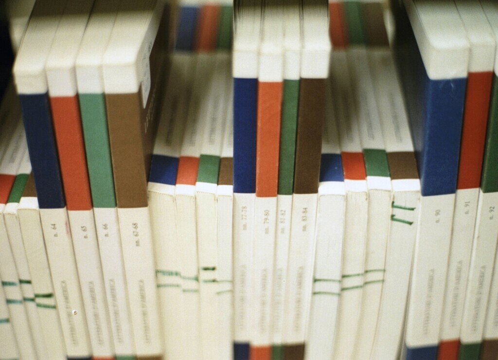 Journals stacked on a shelf