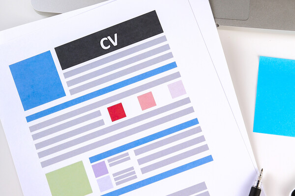 Clip art of a CV on a desk