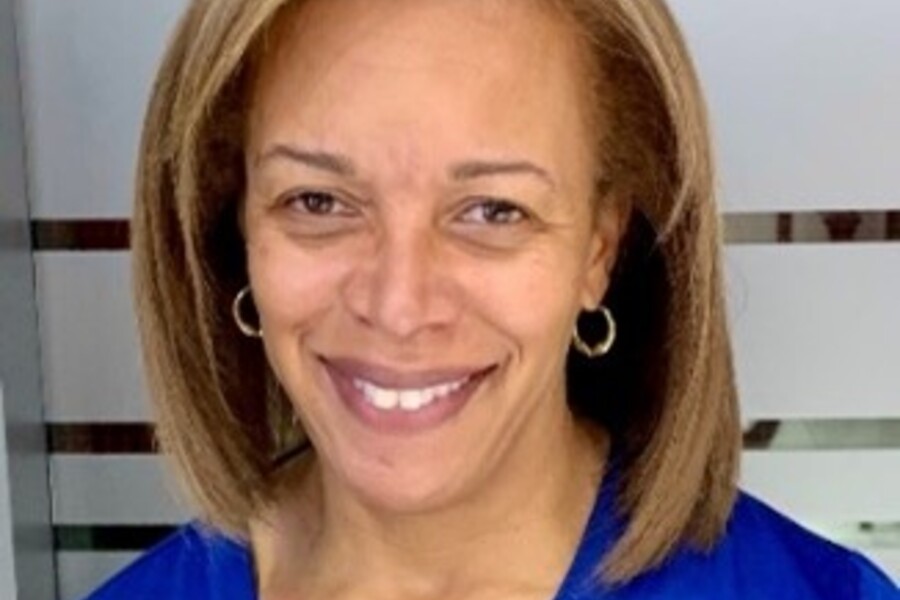 Headshot of Dr. Mireille Norris smiling at the camera