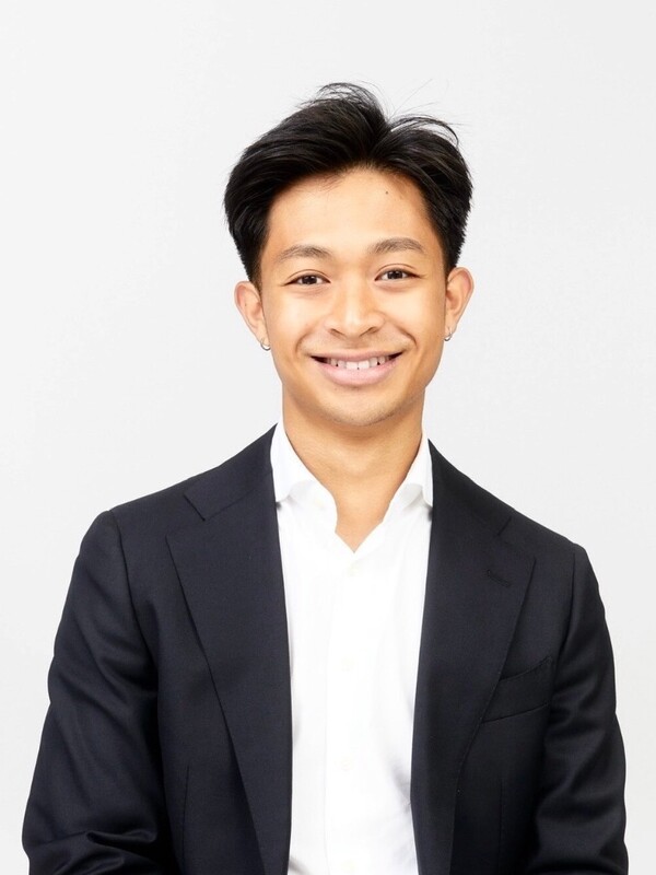 asian man with short dark hair, black blazer and white shirt