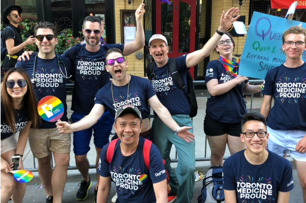 Photo of several people wearing Toronto Medicine Proud shirts
