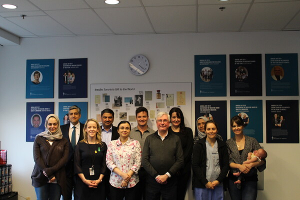 Group of graduating Master Teachers smiling at the camera